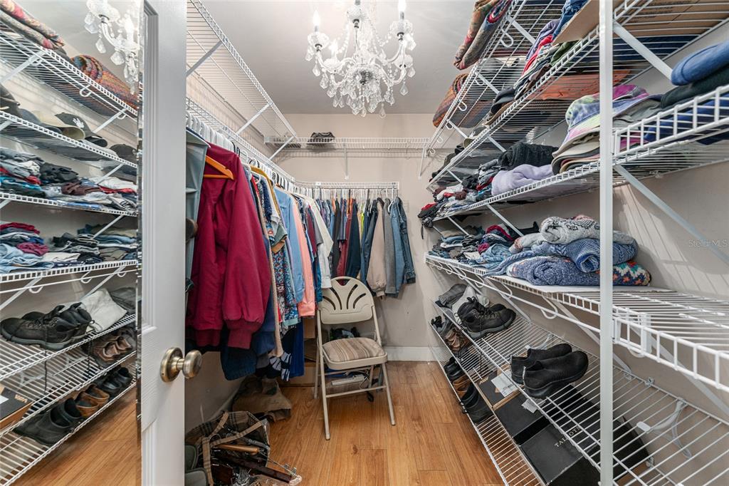 8420 Southwest 92nd Lane Gainesville, FL 32608 - Photo 26 of 46 a view of walk in closet with clothes and shoes