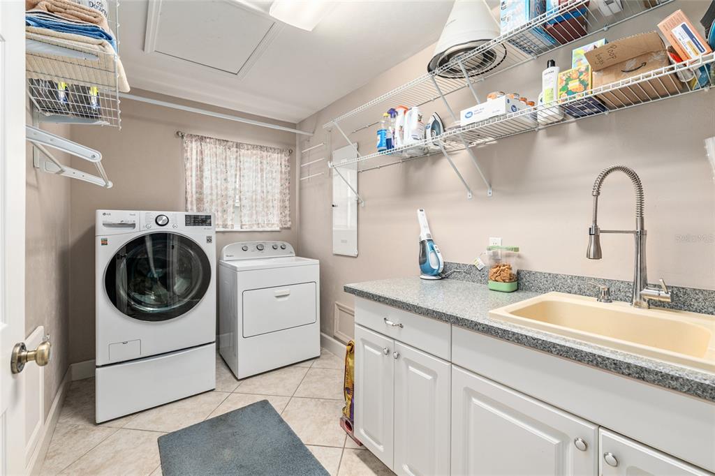 8420 Southwest 92nd Lane Gainesville, FL 32608 - Photo 27 of 46 a utility room with sink dryer and washer