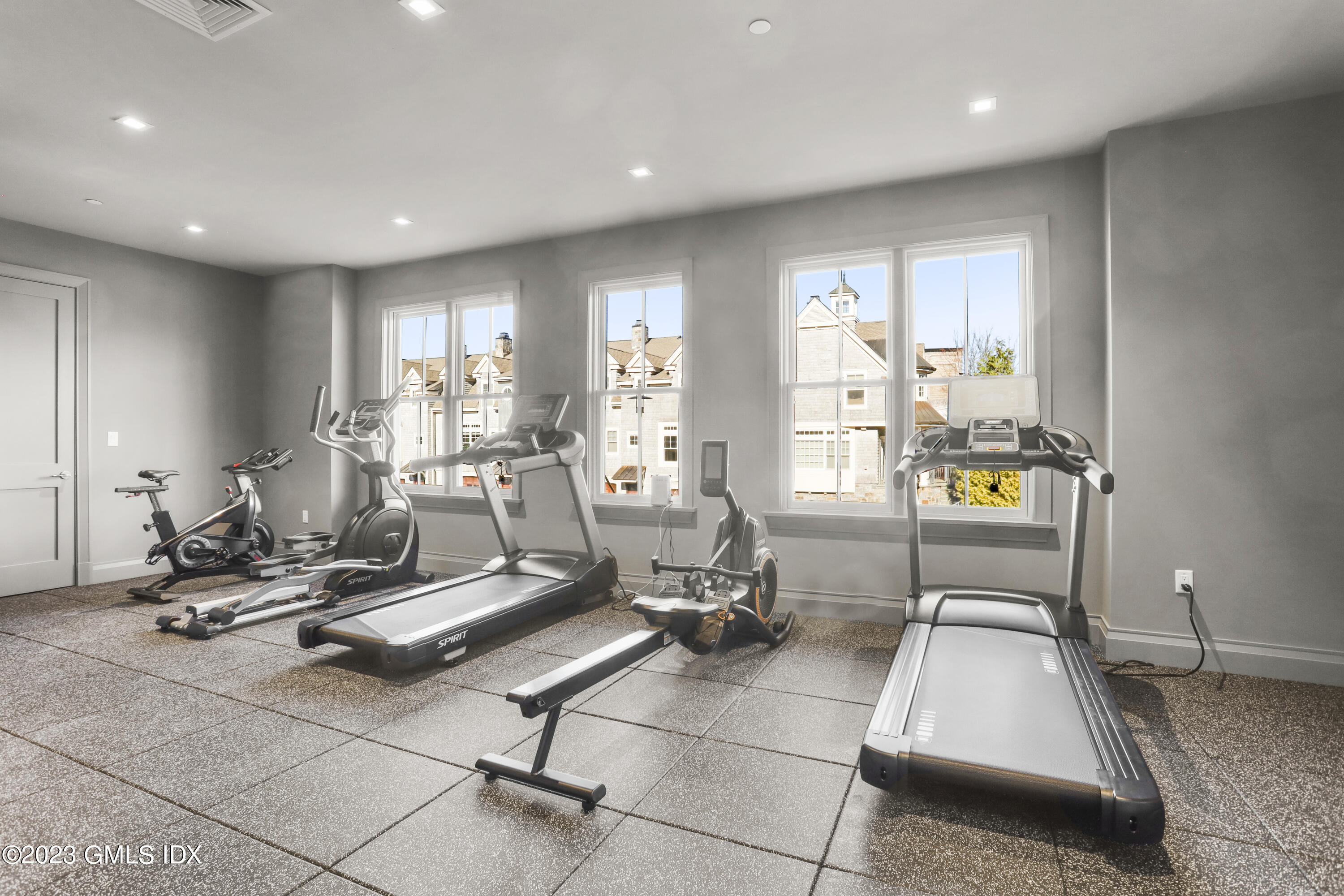 88 South Water Street, Unit 106 Greenwich, CT 06830 - Photo 20 of 24 a room with gym equipment and floor to ceiling window
