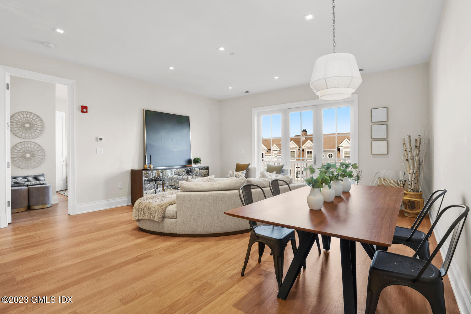 88 South Water Street, Unit 106 Greenwich, CT 06830 - Photo 2 of 24 a view of a dining room with furniture and wooden floor