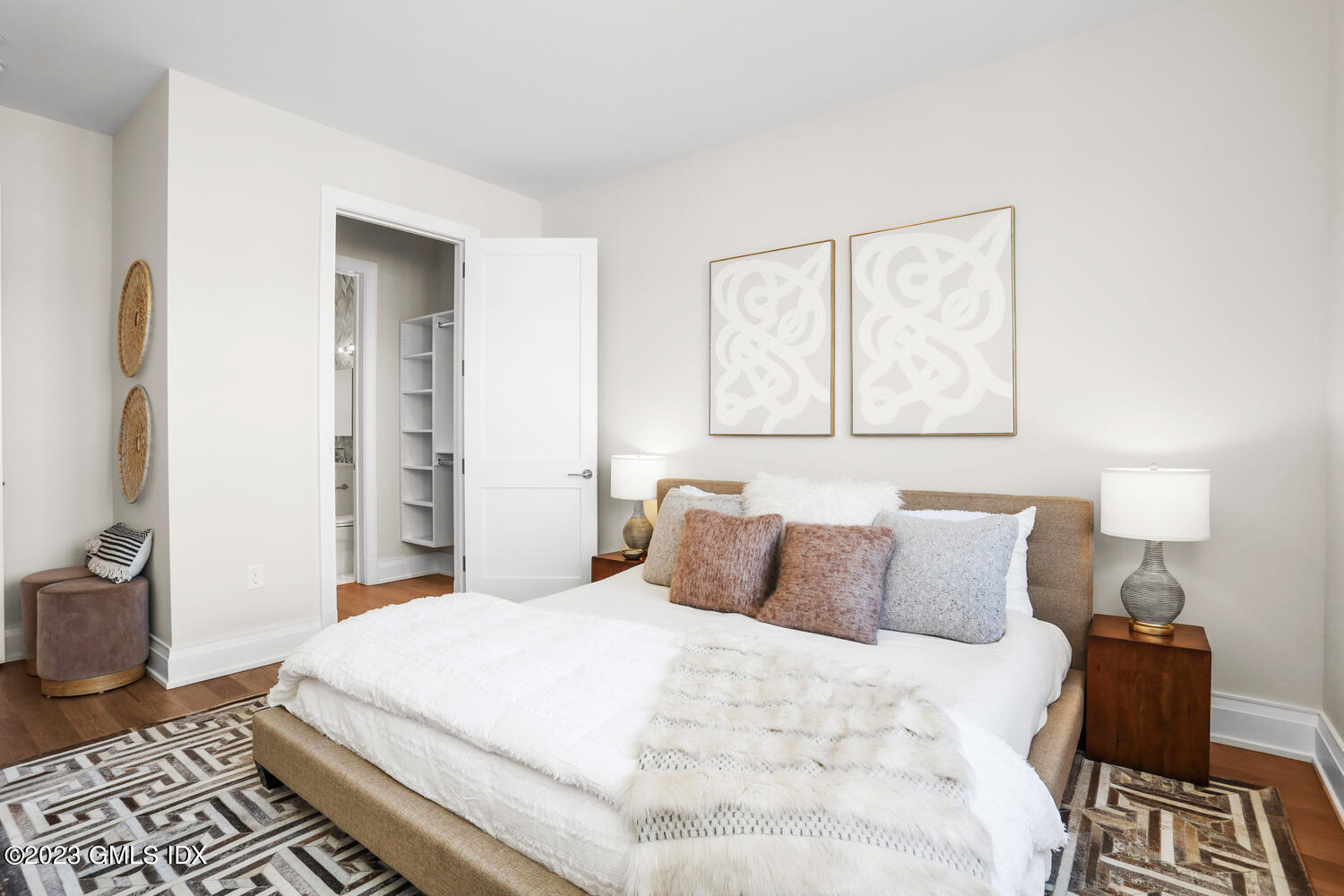 88 South Water Street, Unit 106 Greenwich, CT 06830 - Photo 8 of 24 a bedroom with a bed and wooden floor