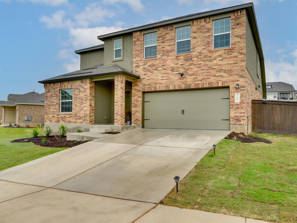 1208 Sweetspire Street Leander, TX 78641 - Photo 35 of 36 Contemporary two-story exterior featuring brick and stucco finishes