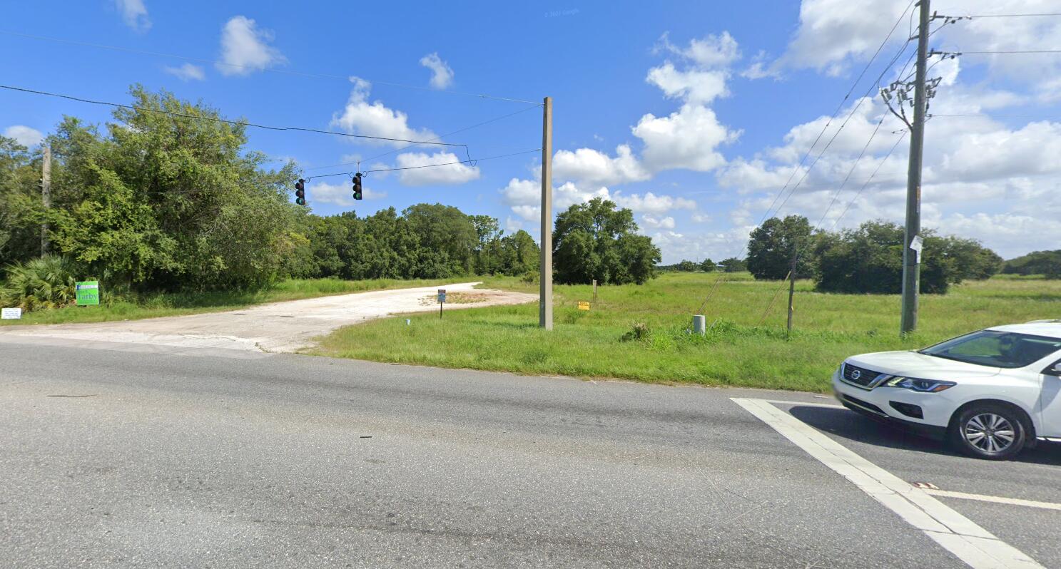 0 State Road 44 Eustis, FL 32736 - Photo 6 of 8 a view of a house with a big yard and basketball court