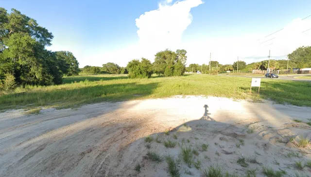 a view of a lake with houses in the background