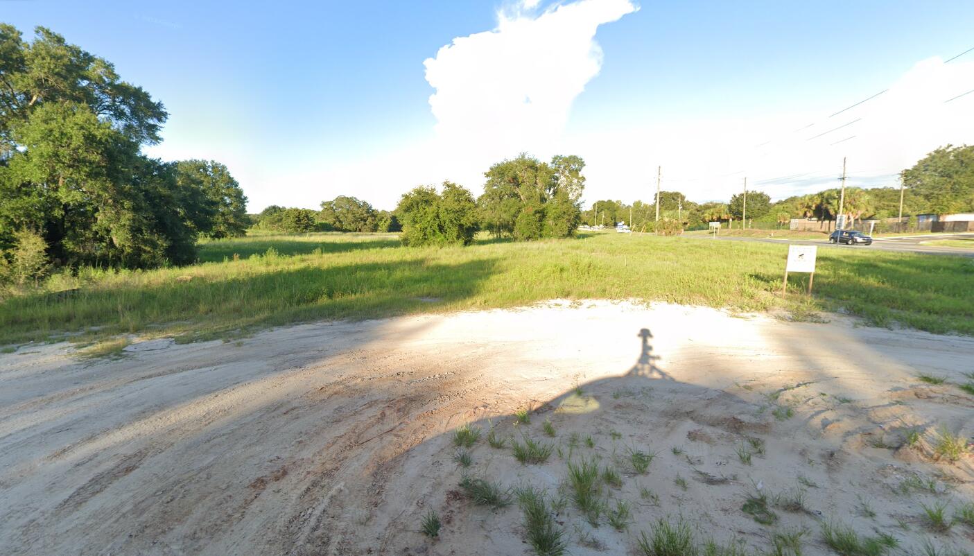 0 State Road 44 Eustis, FL 32736 - Photo 8 of 8 a view of a lake with houses in the background