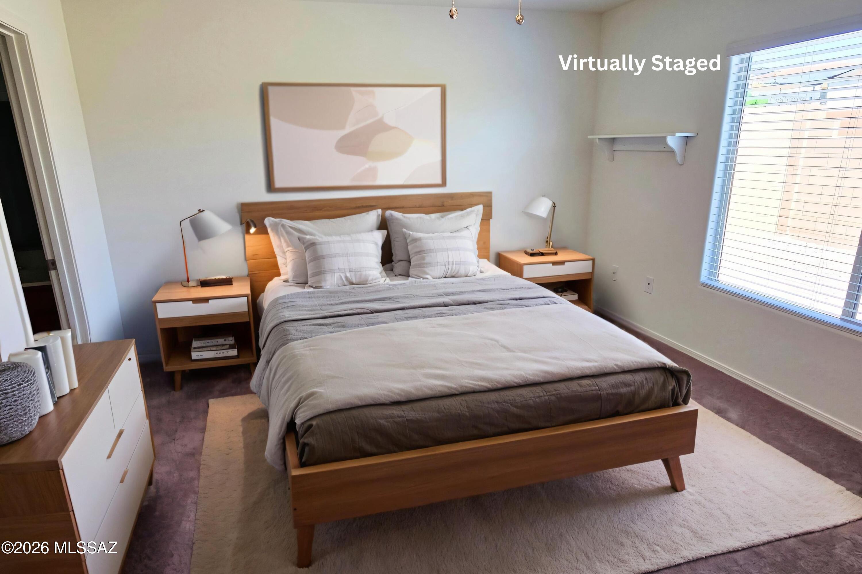 6343 South Rigby Way Tucson, AZ 85746 - Photo 18 of 29 a bedroom with a bed and wooden floor