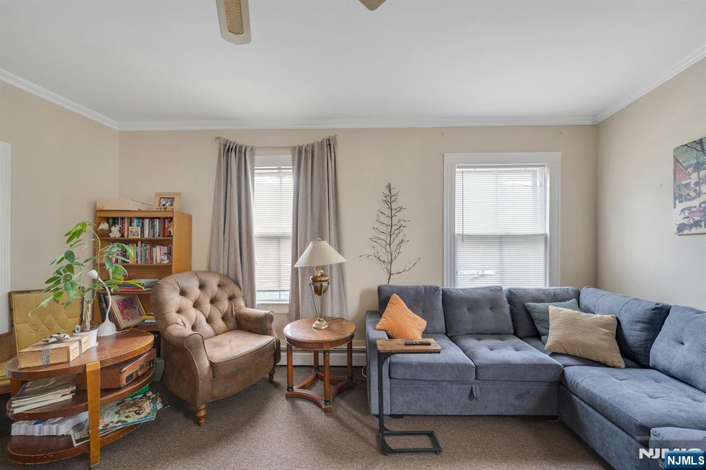 79 Washington Street Harrison, NJ 07029 - Photo 4 of 25 a living room with furniture and a large window