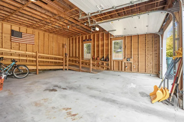 a view of a chair and tables in the backyard