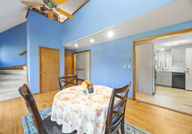 a view of a dining room with furniture and wooden floor