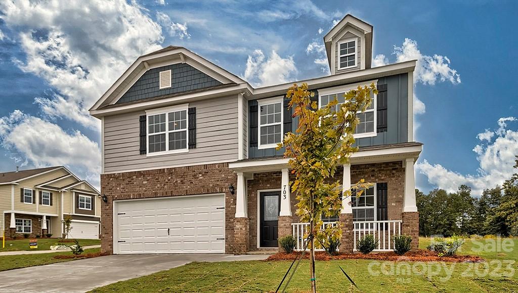 2016 Vanderlyn Street Monroe, NC 28112 - Photo 1 of 32 a front view of a house with a yard