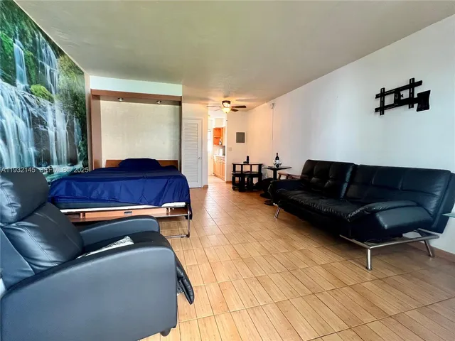 a living room with a couch and a rug