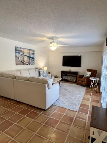 a living room with a couch and a flat screen tv
