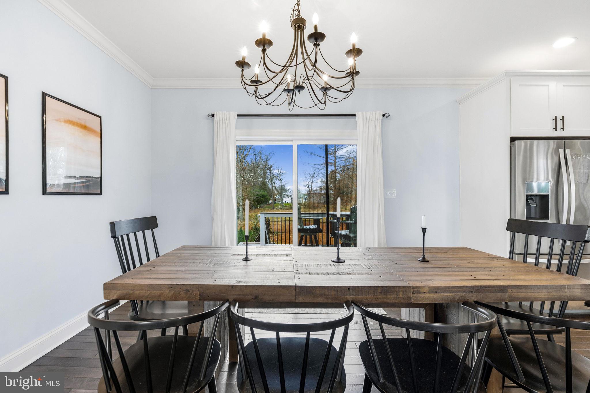 3628 Bay Drive Baltimore, MD 21220 - Photo 13 of 72 a view of a dining room with furniture window and wooden floor