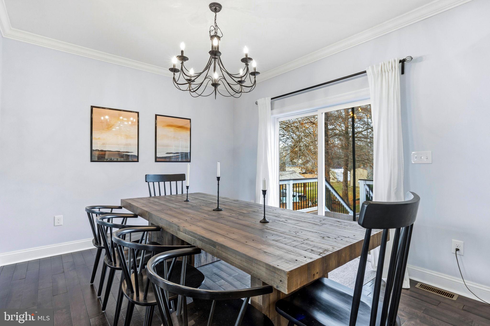 3628 Bay Drive Baltimore, MD 21220 - Photo 16 of 72 a view of a dining room with furniture window and wooden floor
