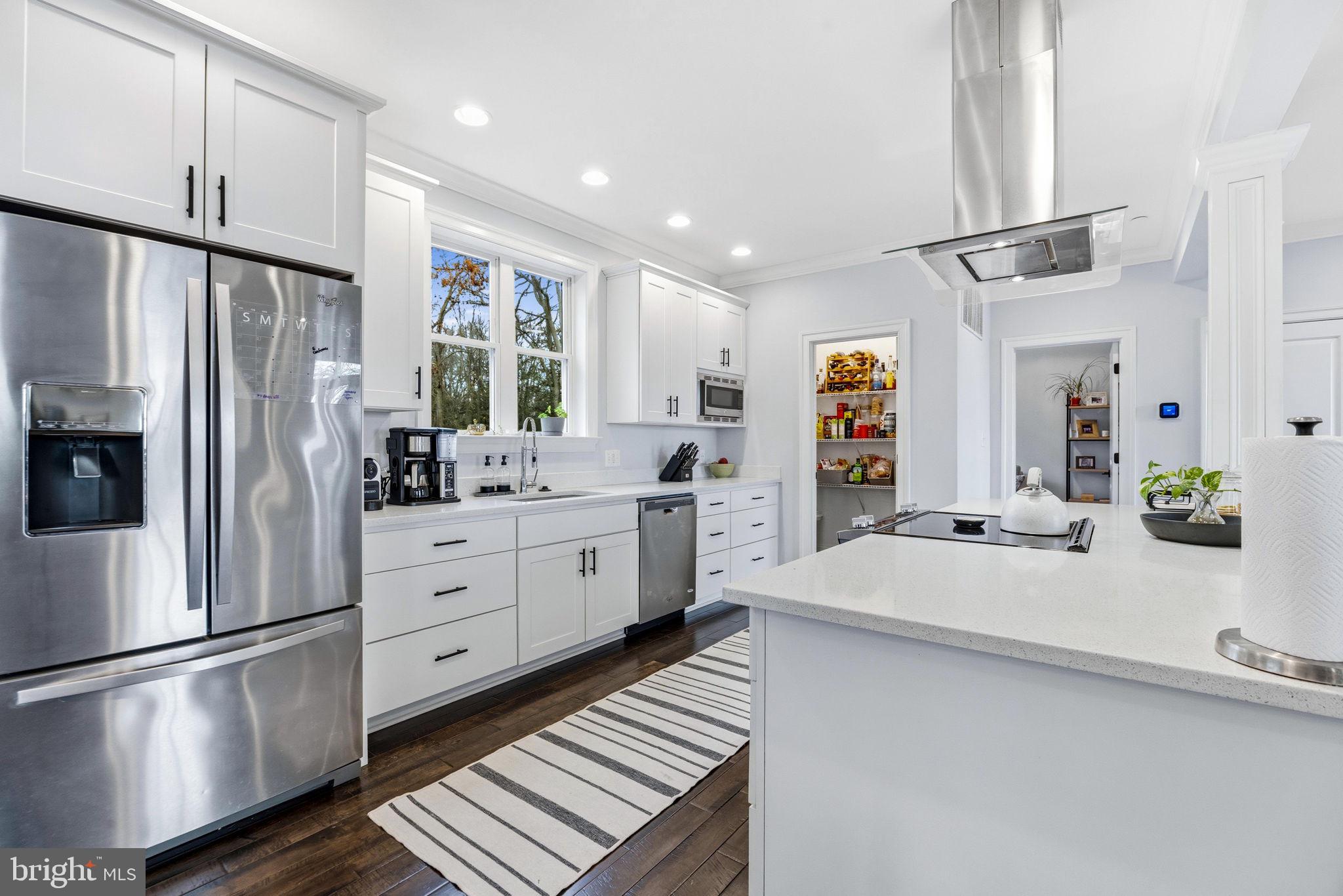 3628 Bay Drive Baltimore, MD 21220 - Photo 22 of 72 a kitchen with stainless steel appliances a refrigerator sink and cabinets