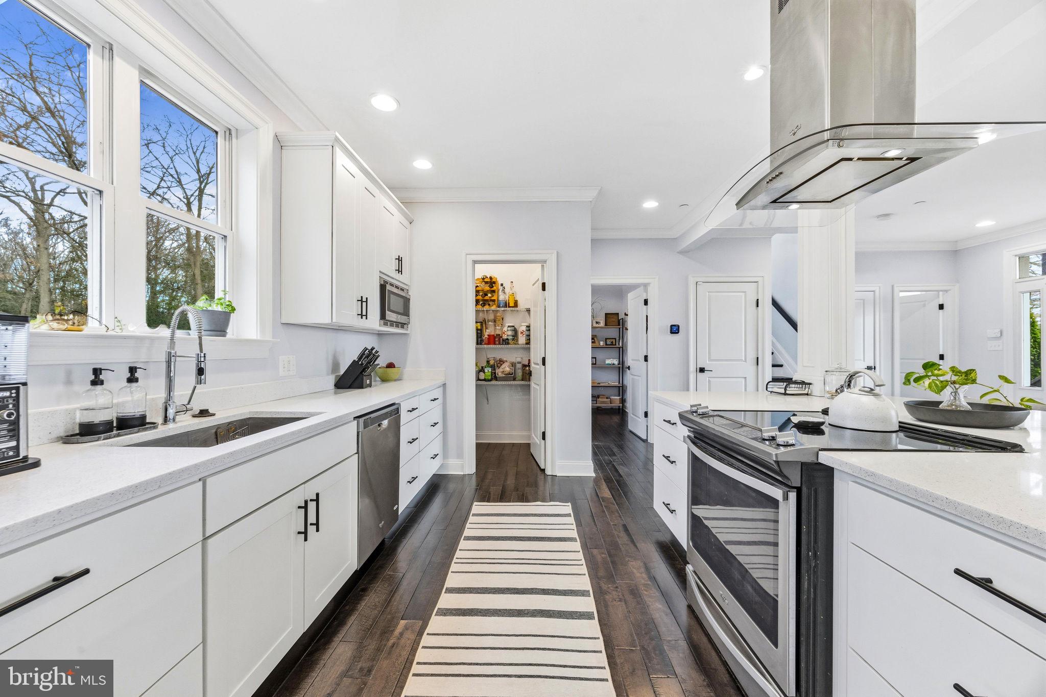 3628 Bay Drive Baltimore, MD 21220 - Photo 24 of 72 a kitchen with stainless steel appliances a sink stove and cabinets