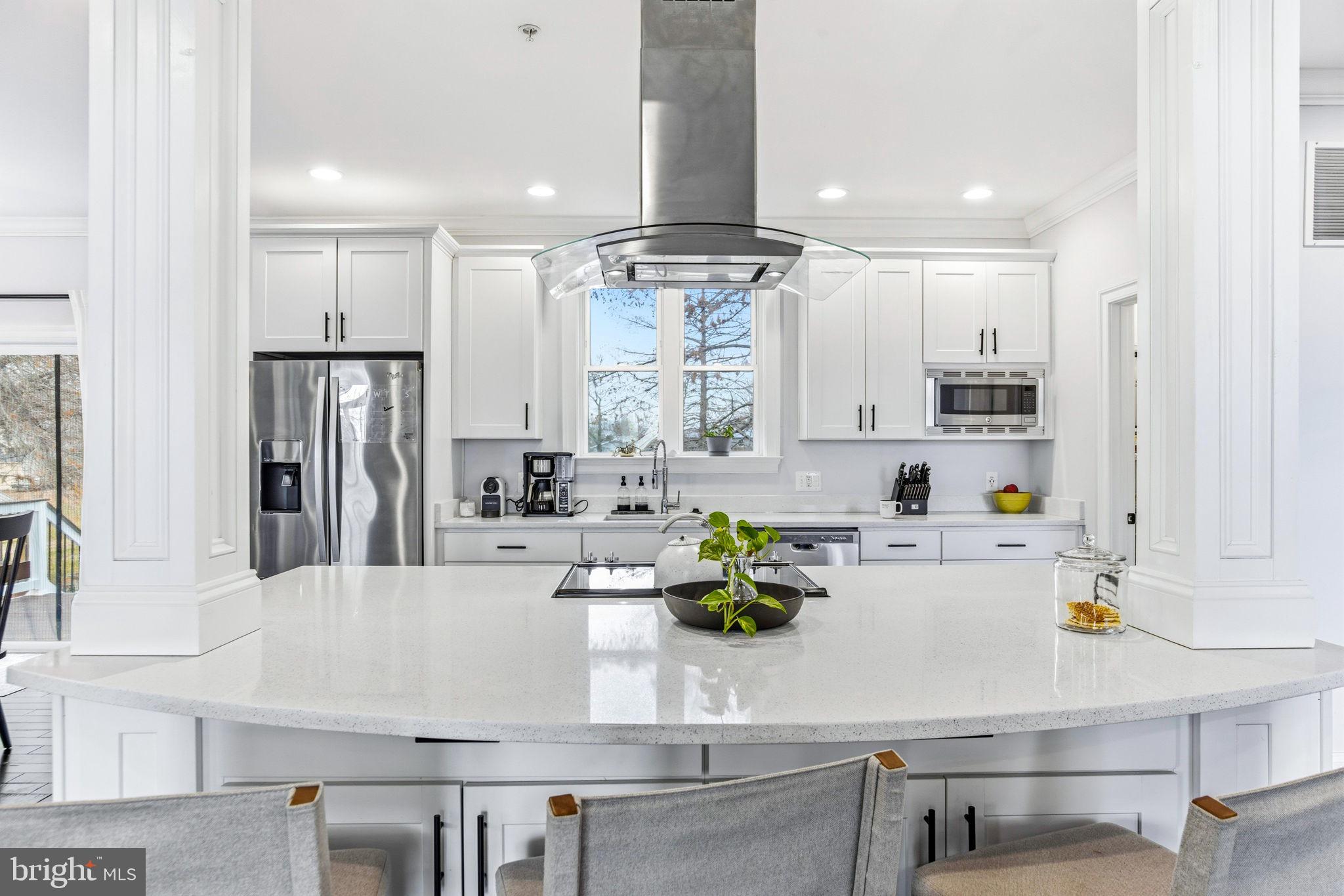3628 Bay Drive Baltimore, MD 21220 - Photo 27 of 72 a kitchen with kitchen island a white counter top space cabinets and stainless steel appliances