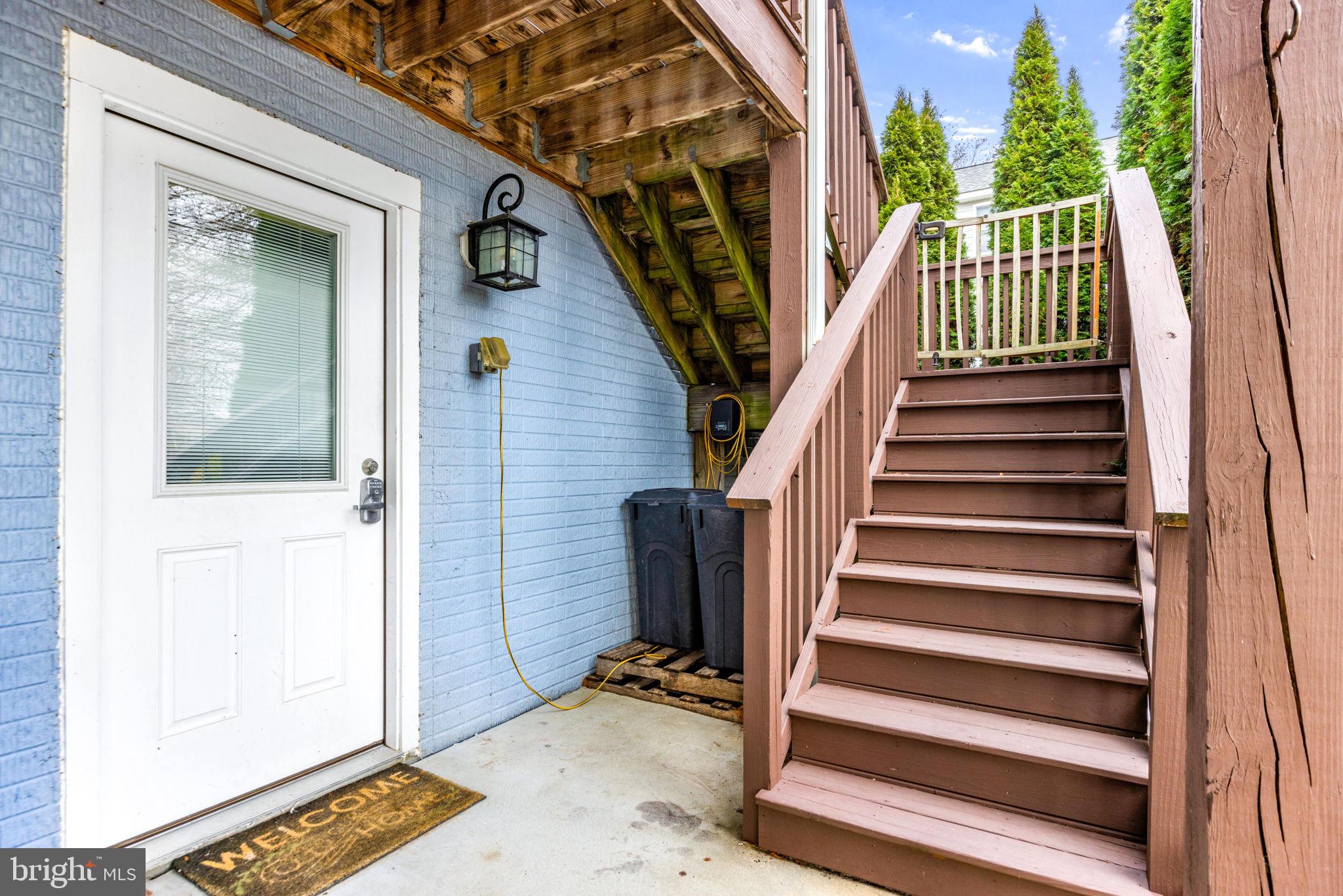 3628 Bay Drive Baltimore, MD 21220 - Photo 3 of 72 a view of entryway with wooden floor and stairs