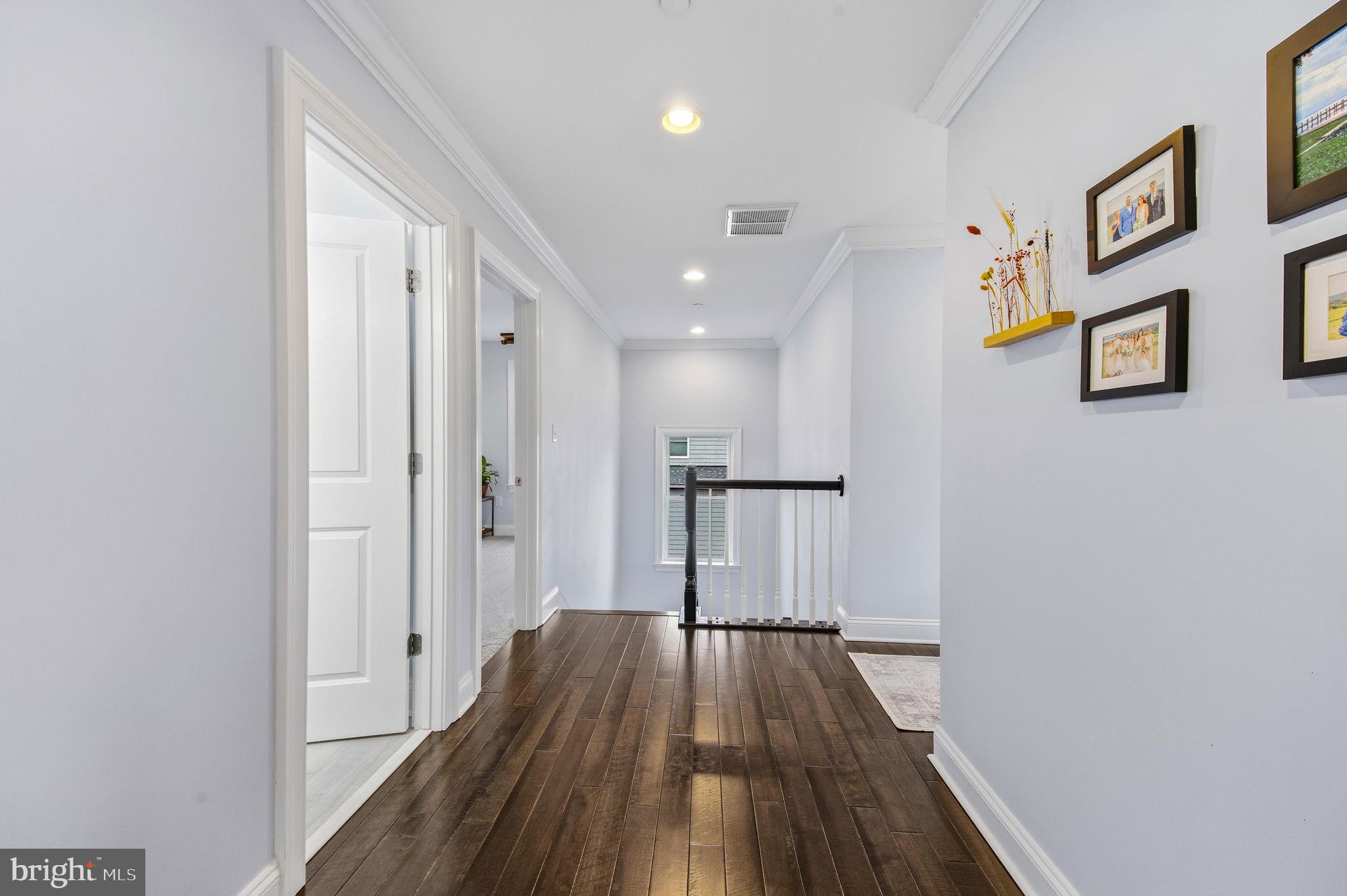 3628 Bay Drive Baltimore, MD 21220 - Photo 31 of 72 a view of a hallway with wooden floor