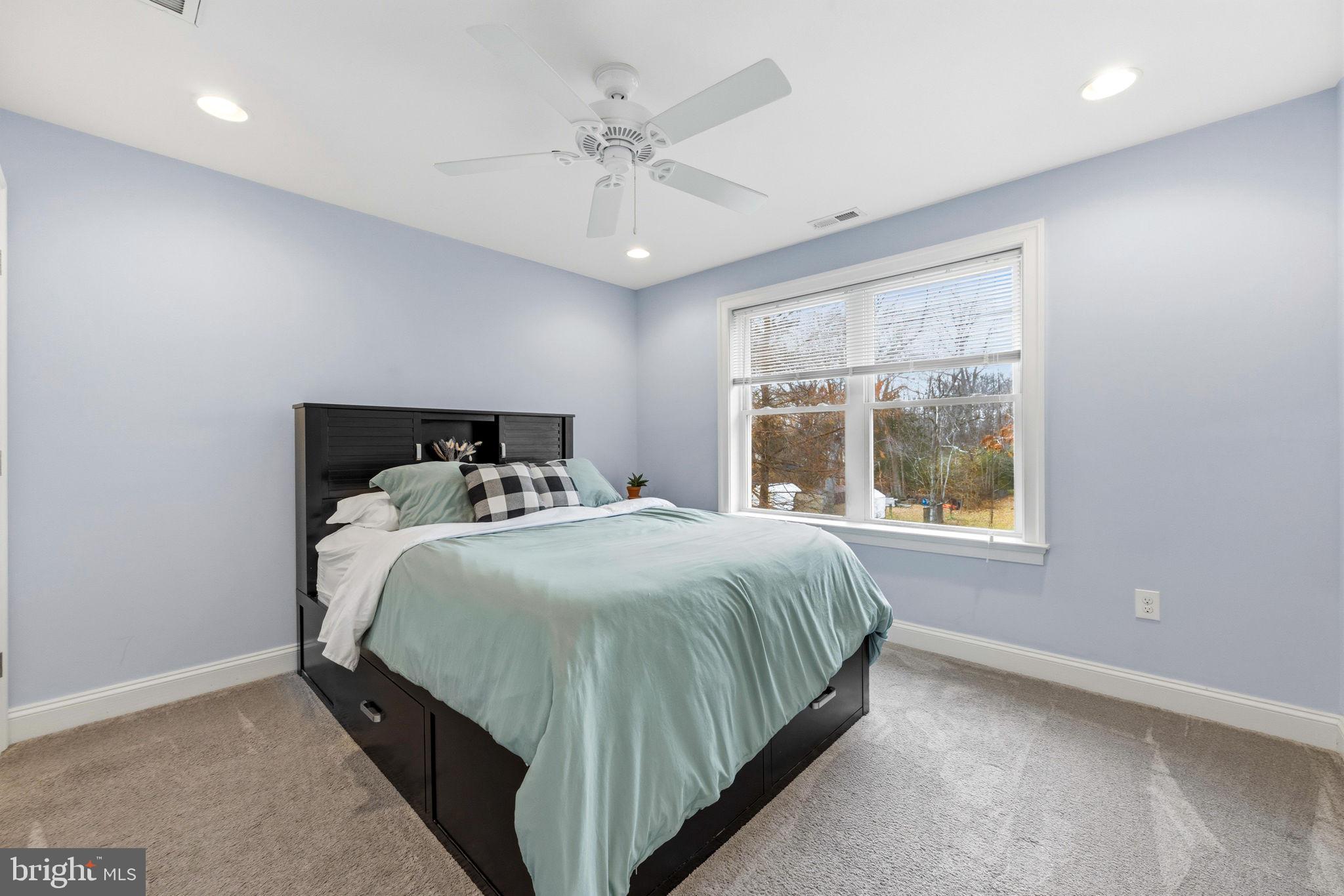 3628 Bay Drive Baltimore, MD 21220 - Photo 36 of 72 a bedroom with a bed and window