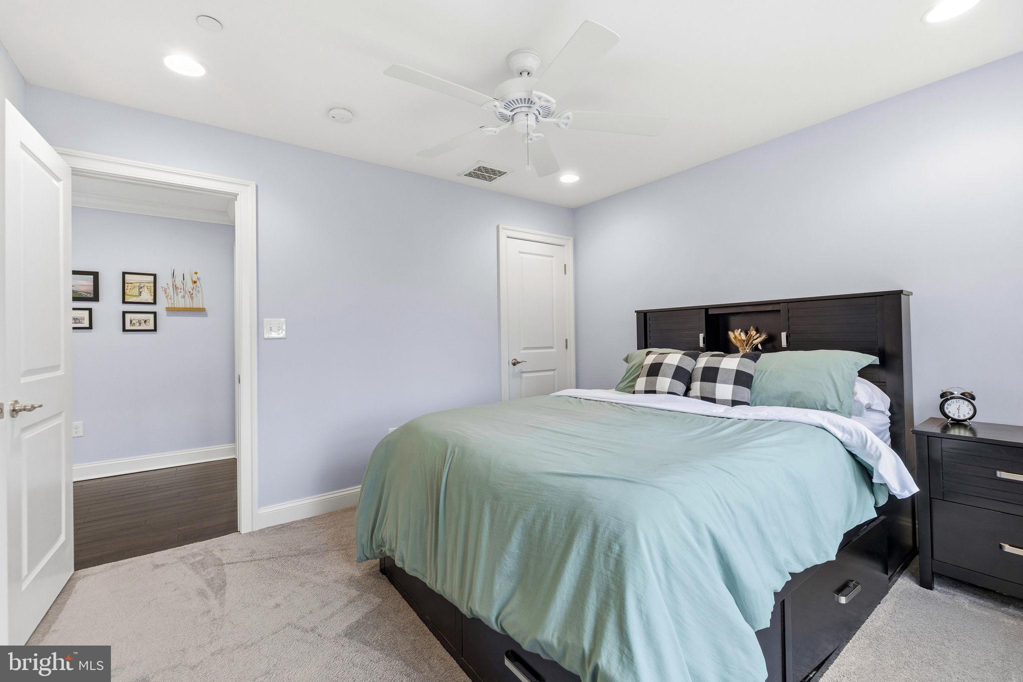 3628 Bay Drive Baltimore, MD 21220 - Photo 37 of 72 a bedroom with a large bed and a chandelier