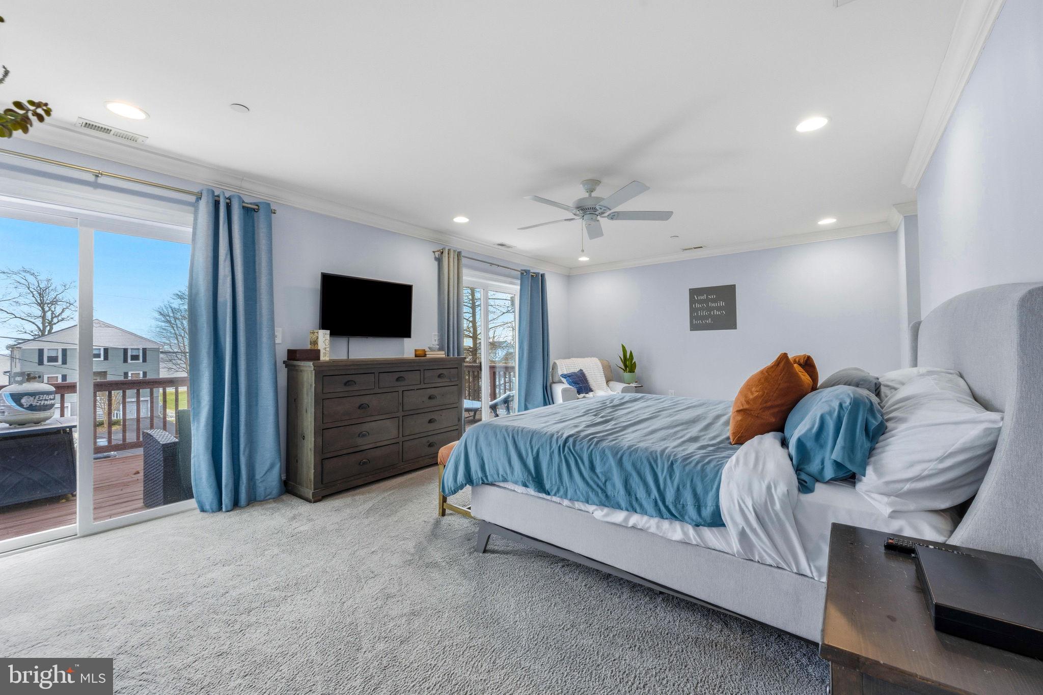 3628 Bay Drive Baltimore, MD 21220 - Photo 38 of 72 a spacious bedroom with a bed and a flat screen tv