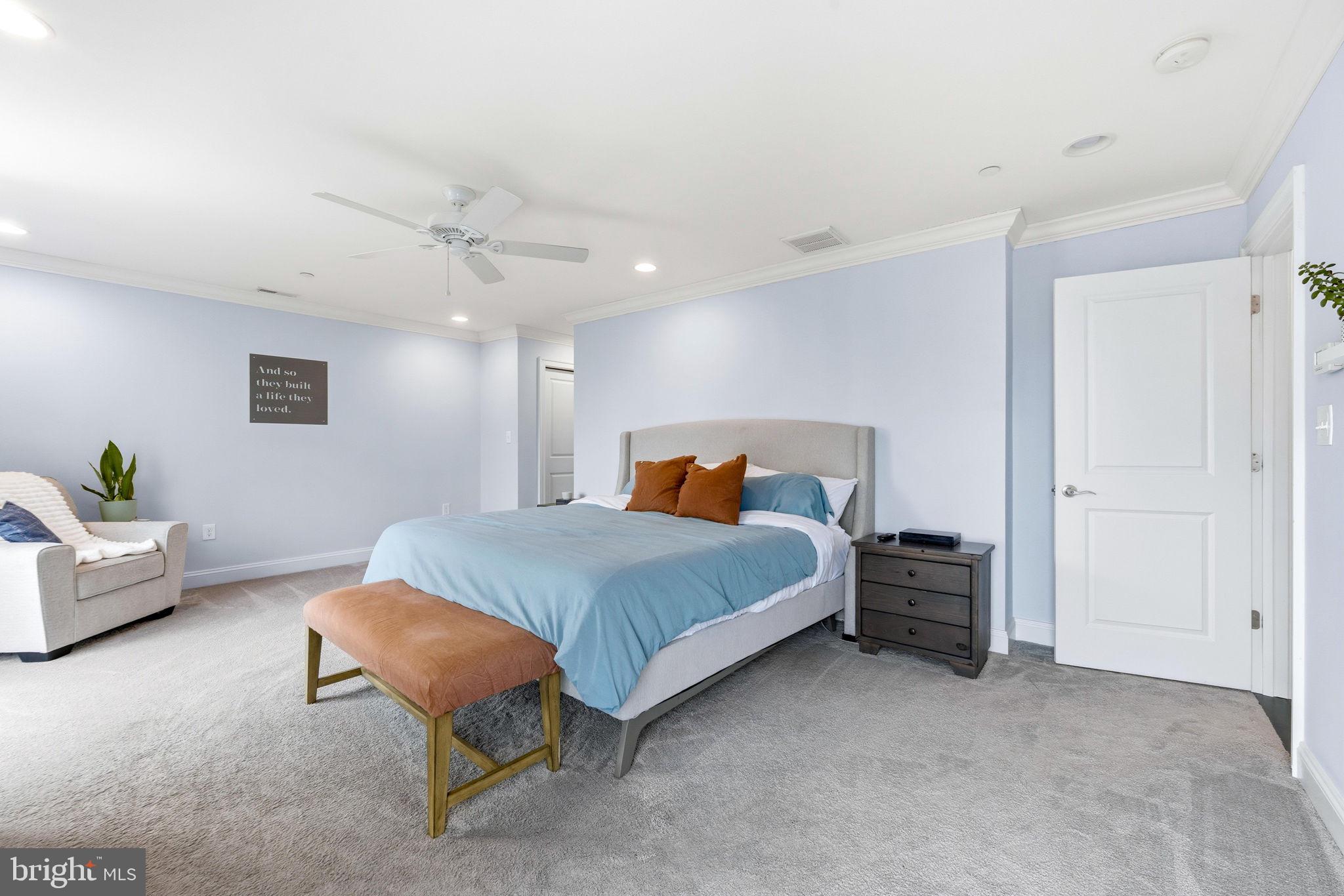 3628 Bay Drive Baltimore, MD 21220 - Photo 39 of 72 a spacious bedroom with a bed and a couch