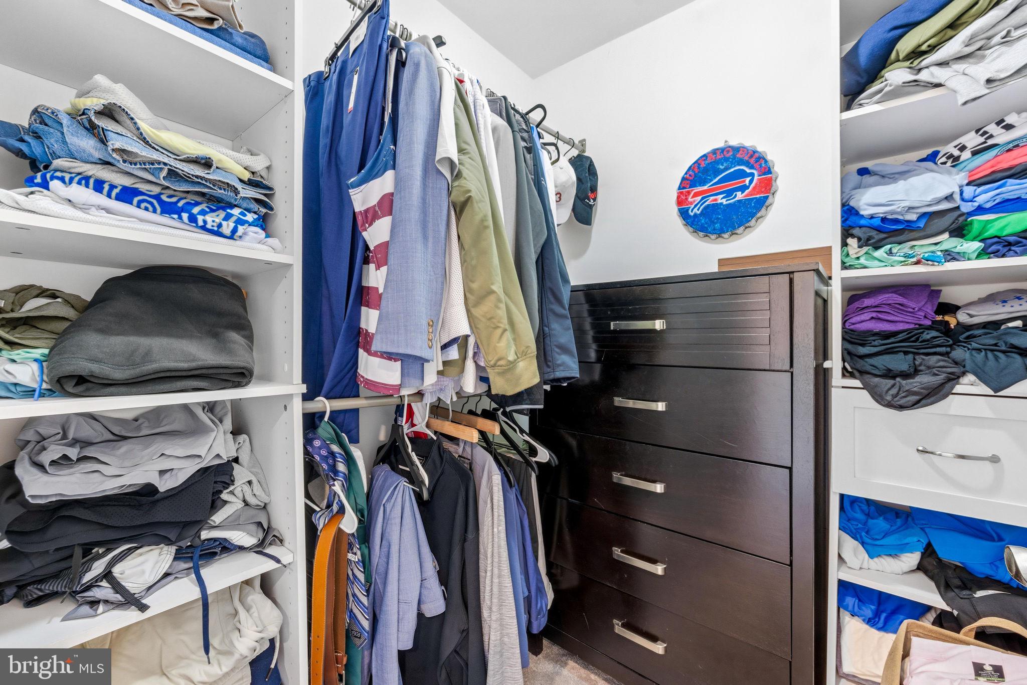 3628 Bay Drive Baltimore, MD 21220 - Photo 43 of 72 a view of walk in closet with clothes