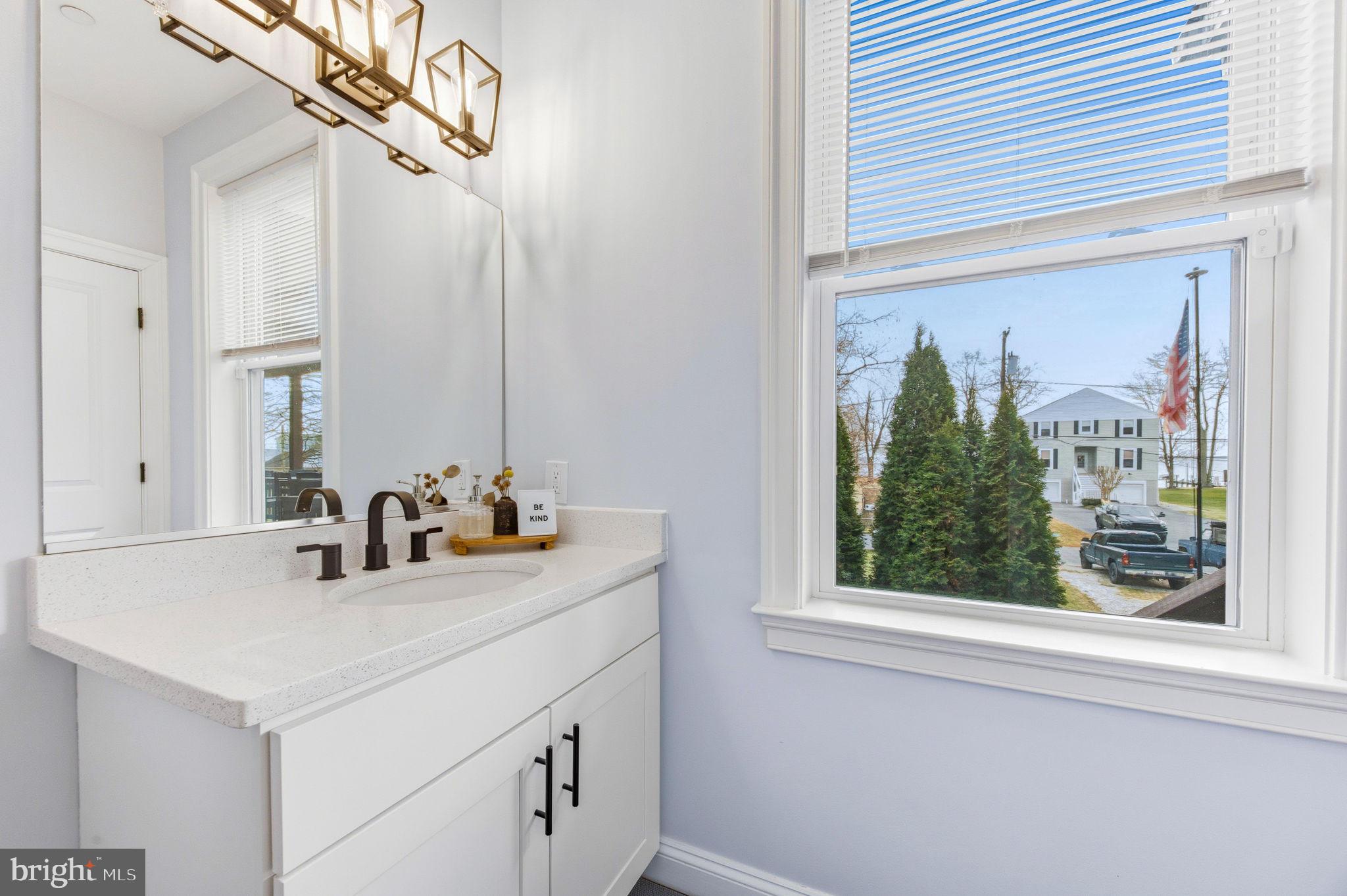3628 Bay Drive Baltimore, MD 21220 - Photo 51 of 72 a bathroom with a sink and a mirror