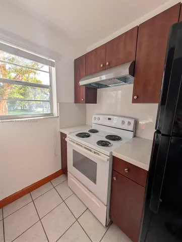 a kitchen with a stove and a microwave