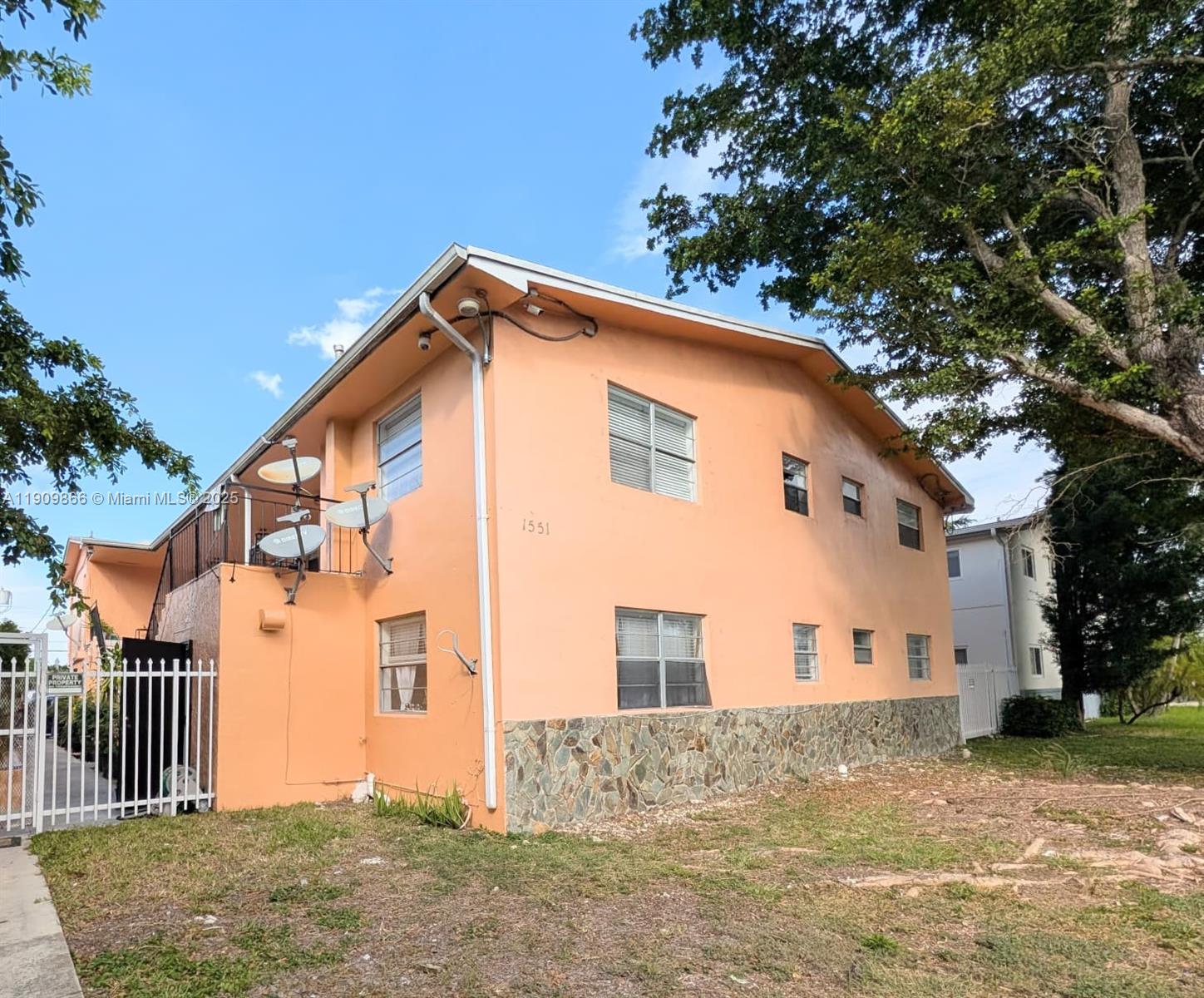 1551 Northeast 8th Street, Unit 5 Homestead, FL 33033 - Photo 6 of 8 a front view of a house with a yard