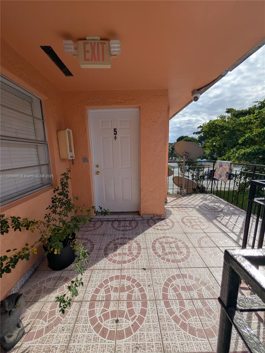 1551 Northeast 8th Street, Unit 5 Homestead, FL 33033 - Photo 7 of 8 a house view with a outdoor space