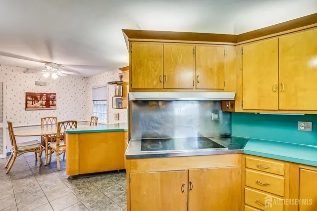 a bedroom with bed and a chandelier