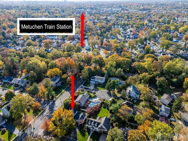 a view of a house with a tree