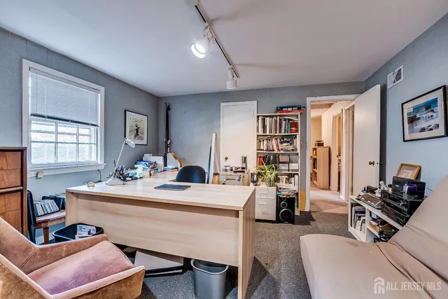 a view of a yard with plants and trees