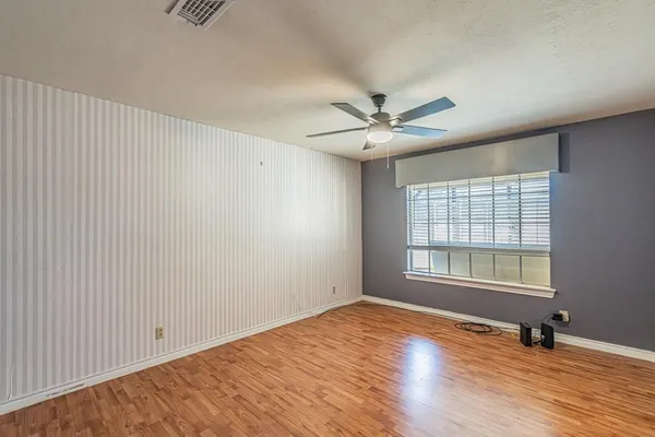 an empty room with a empty space and windows