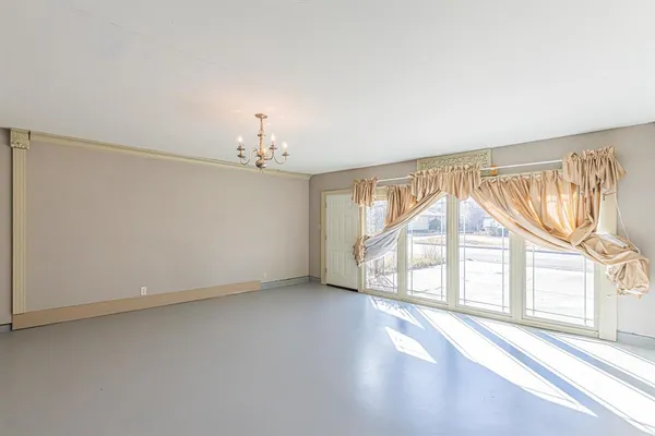 wooden floor in an empty room with a fireplace