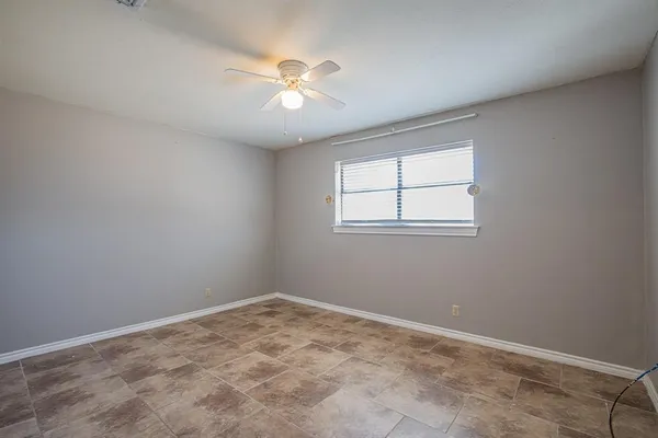 a view of an empty room and wooden floor