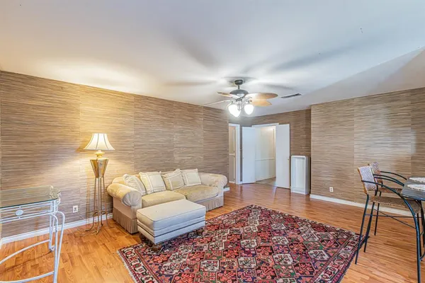 a living room with furniture and a rug