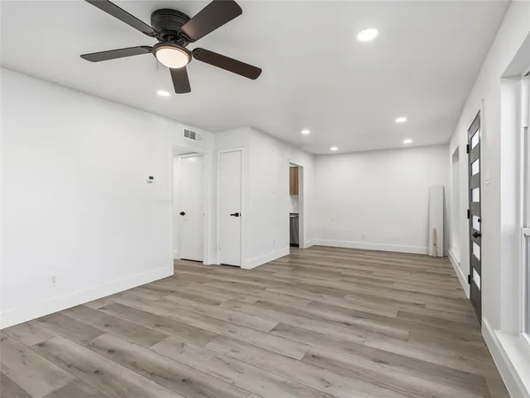a kitchen with a sink a counter top space and cabinets