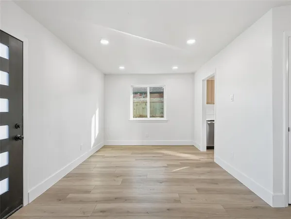 a kitchen with a sink cabinets and a window