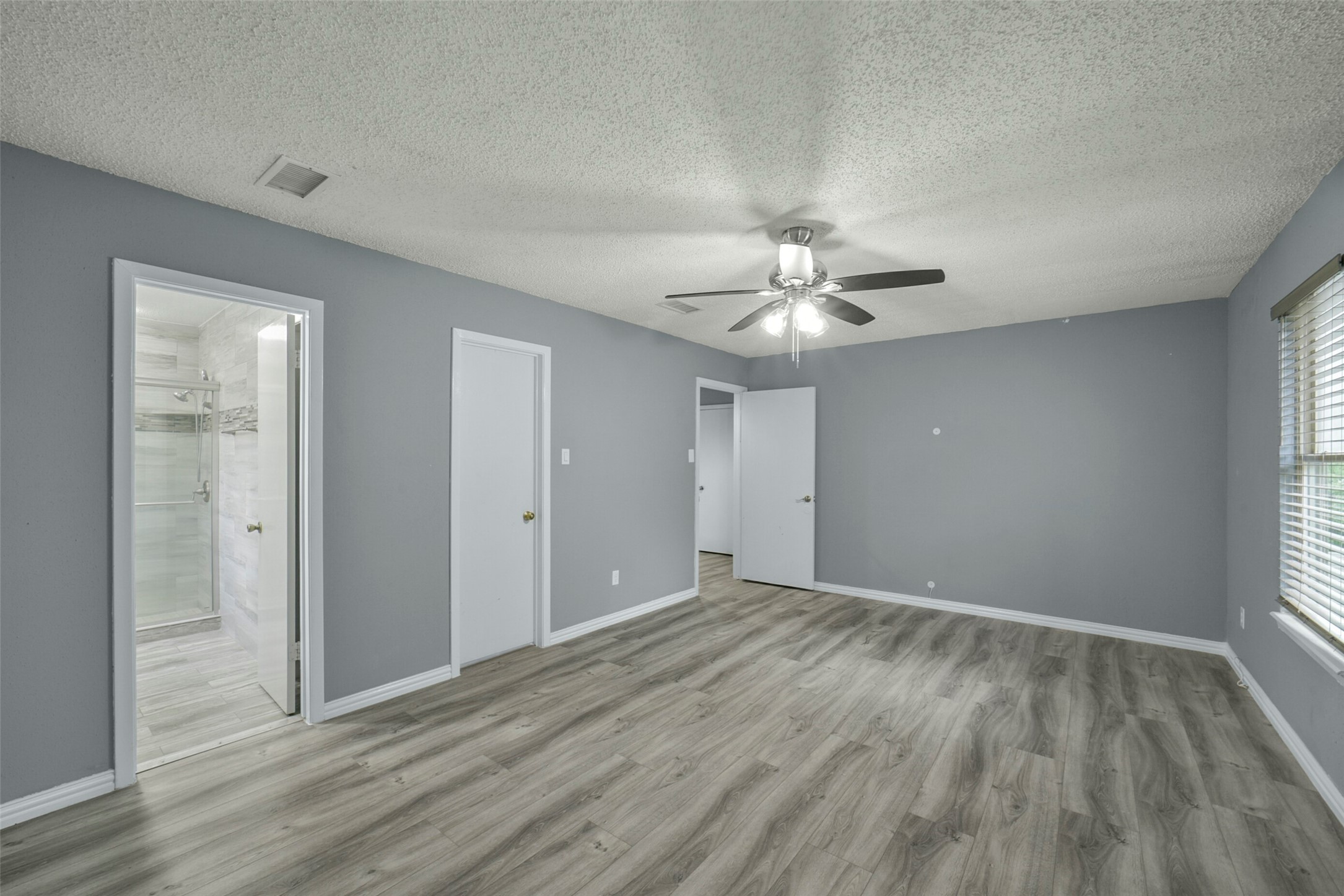 18606 Mellowgrove Lane Spring, TX 77379 - Photo 21 of 43 Another view of the primary bedroom showing the ensuite bath