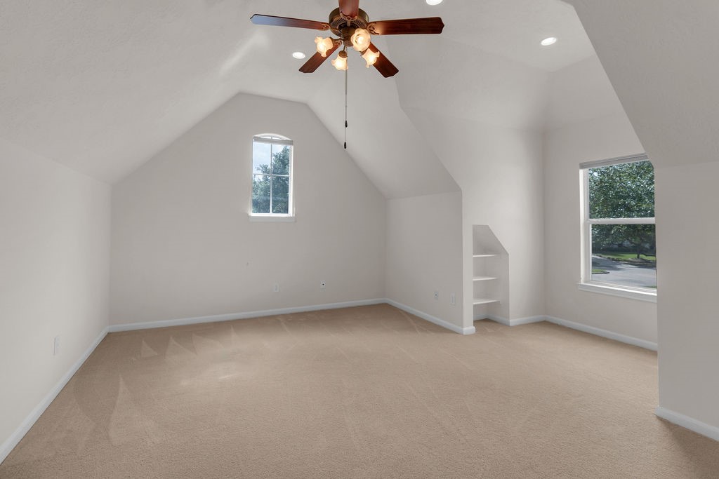 7306 Starflower Katy, TX 77494 - Photo 39 of 50 en empty room with windows and ceiling fan