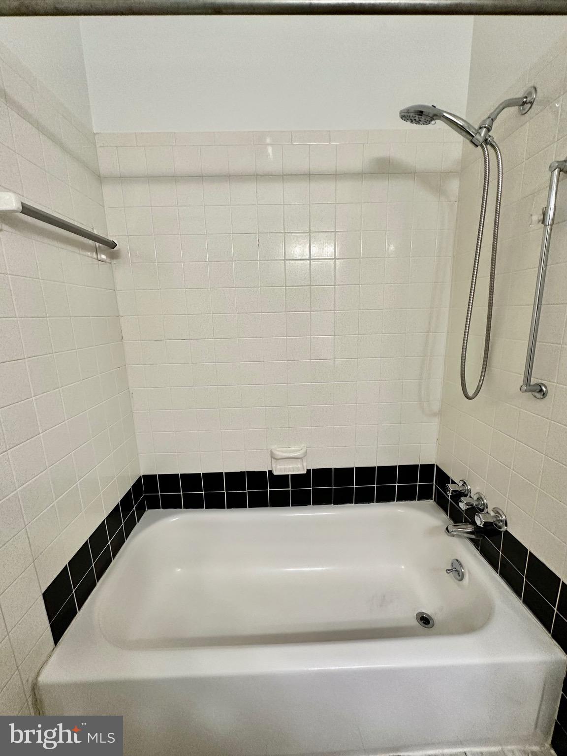 302 Hills Drive Gettysburg, PA 17325 - Photo 14 of 17 a bathroom with a bathtub and a shower