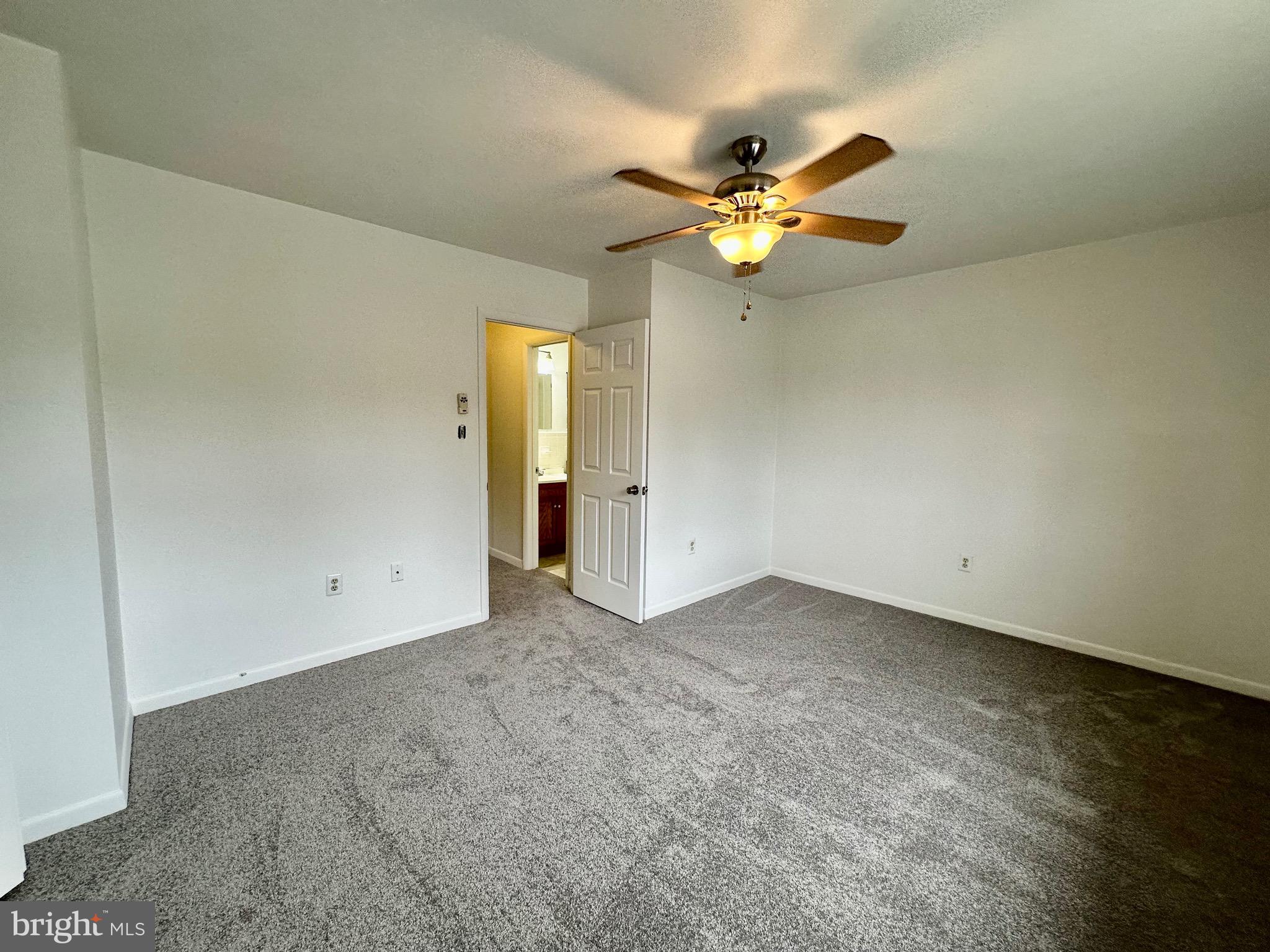 302 Hills Drive Gettysburg, PA 17325 - Photo 16 of 17 an empty room with closet and a chandelier fan
