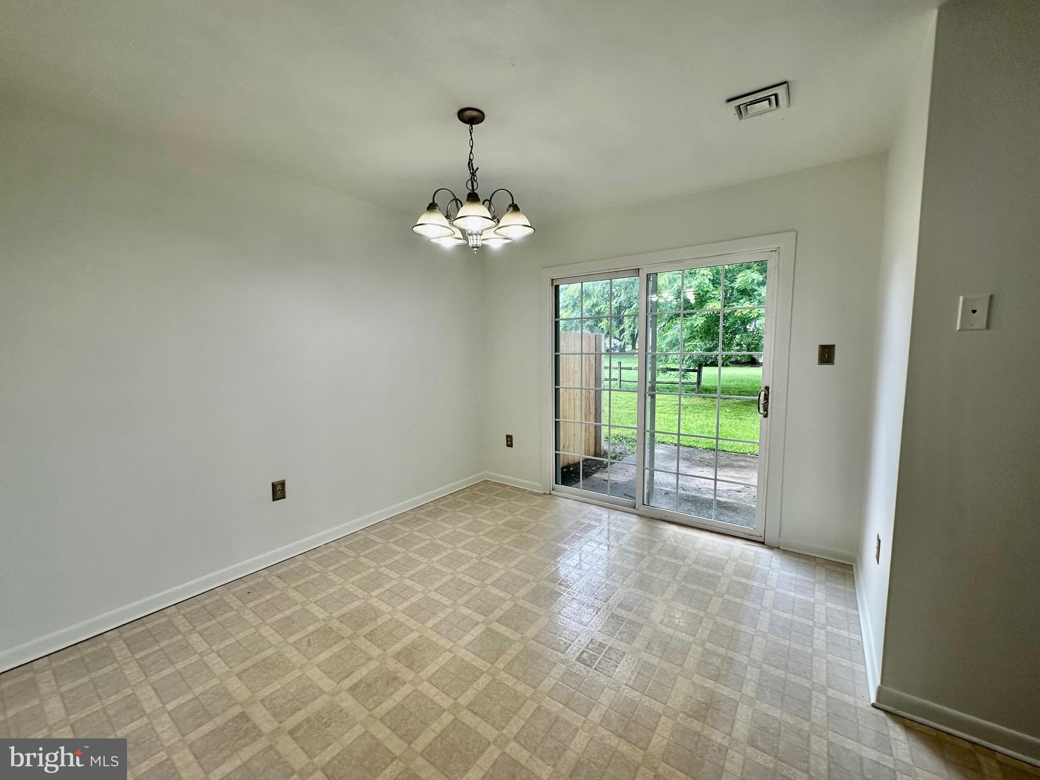 302 Hills Drive Gettysburg, PA 17325 - Photo 4 of 17 a view of empty room with wooden floor and fan