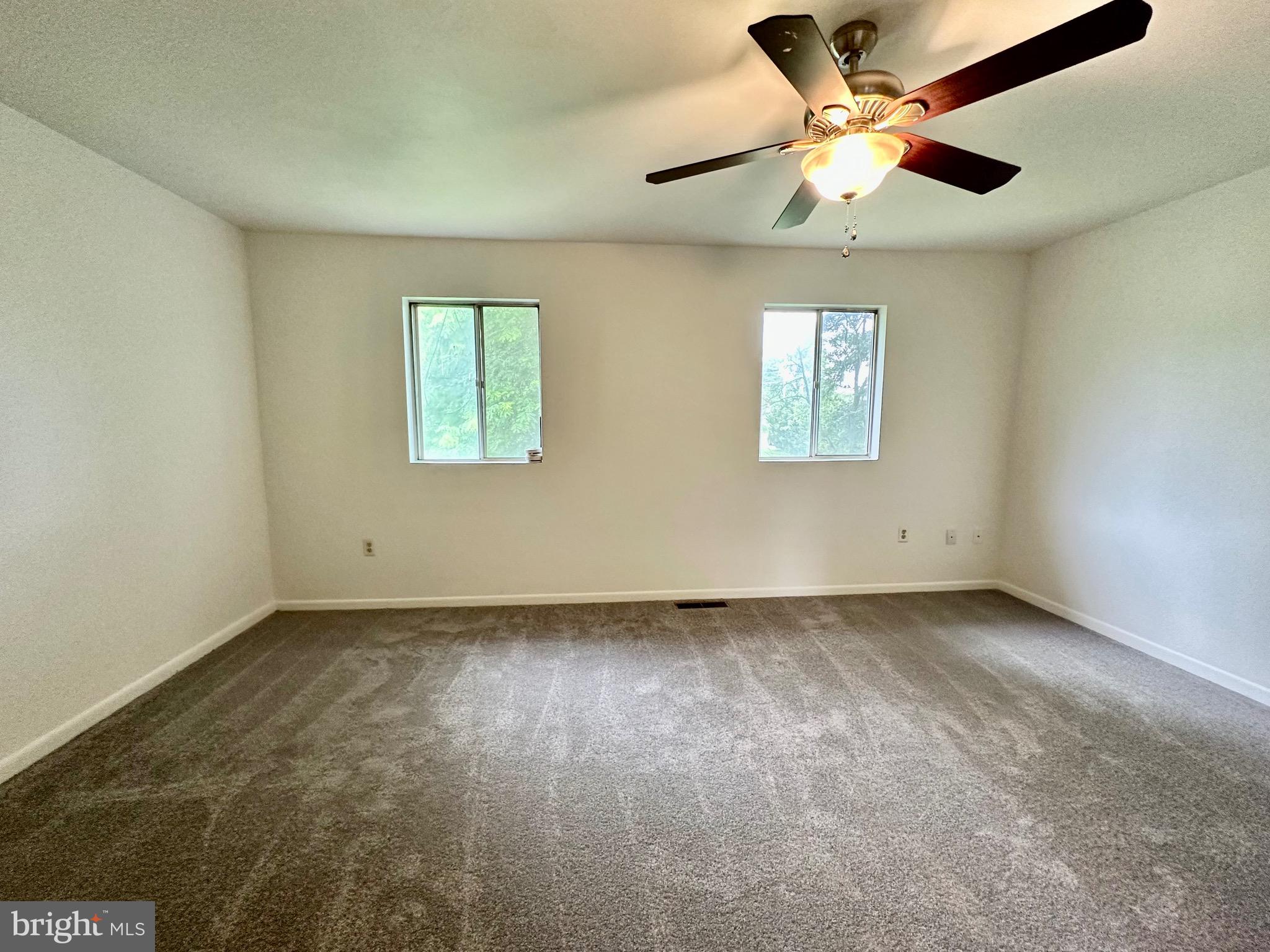 302 Hills Drive Gettysburg, PA 17325 - Photo 9 of 17 an empty room with a window and a fan