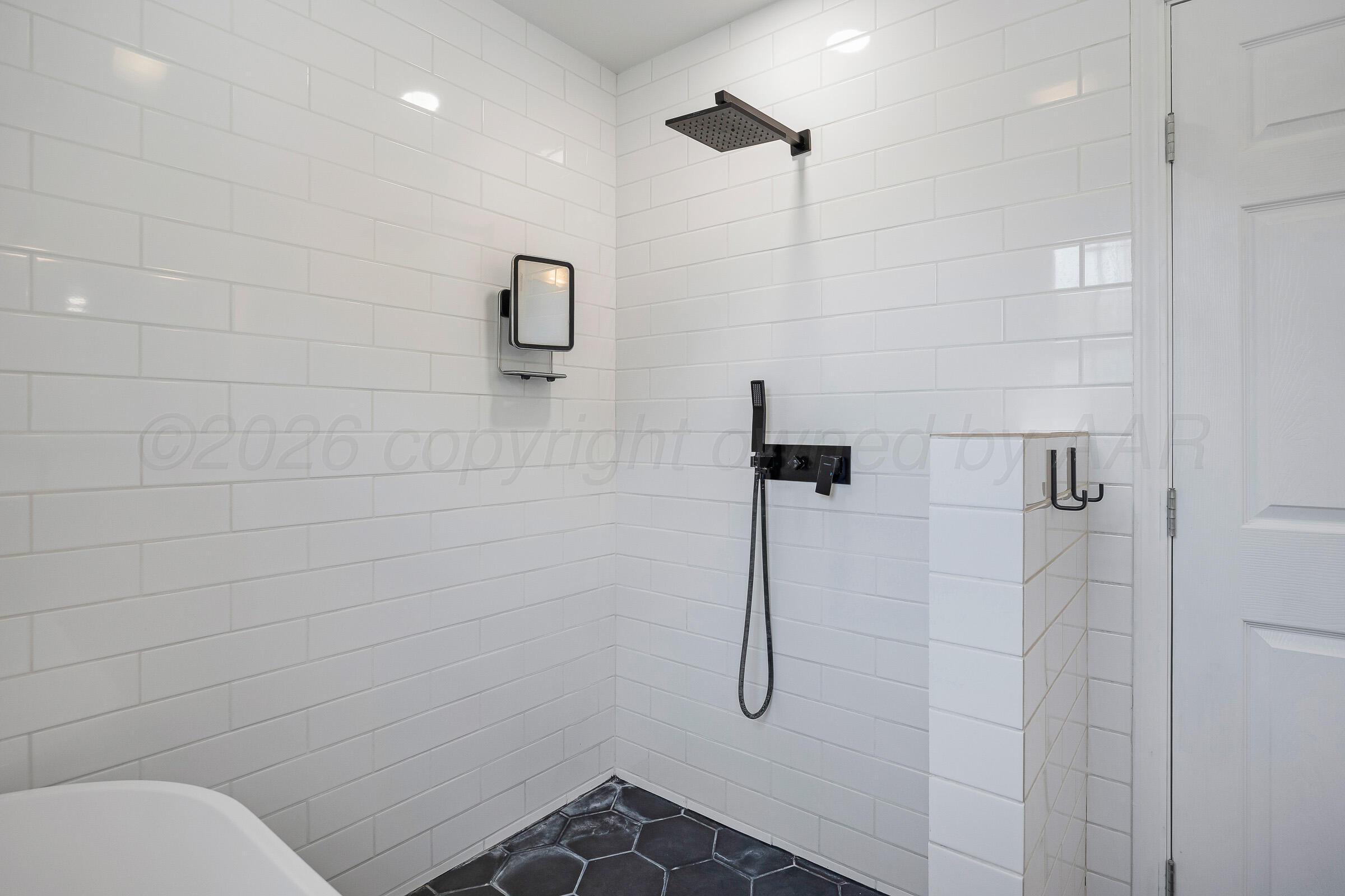 2102 South Hayden Street Amarillo, TX 79109 - Photo 29 of 44 a bathroom with a shower