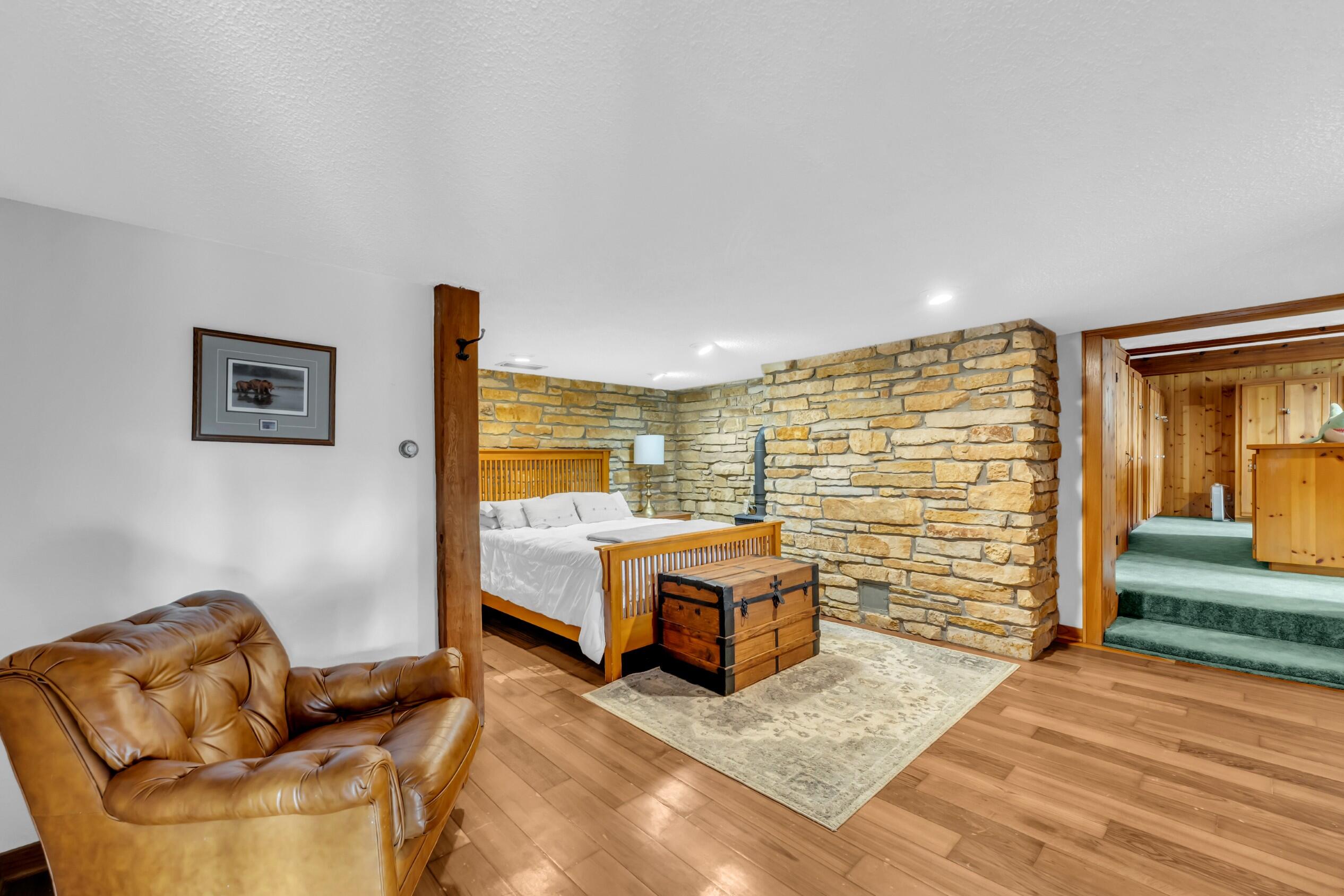 N3075 Hardscrabble Road Palmyra, WI 53156 - Photo 53 of 69 Downstairs Bedroomw/ Accented Rock Wall