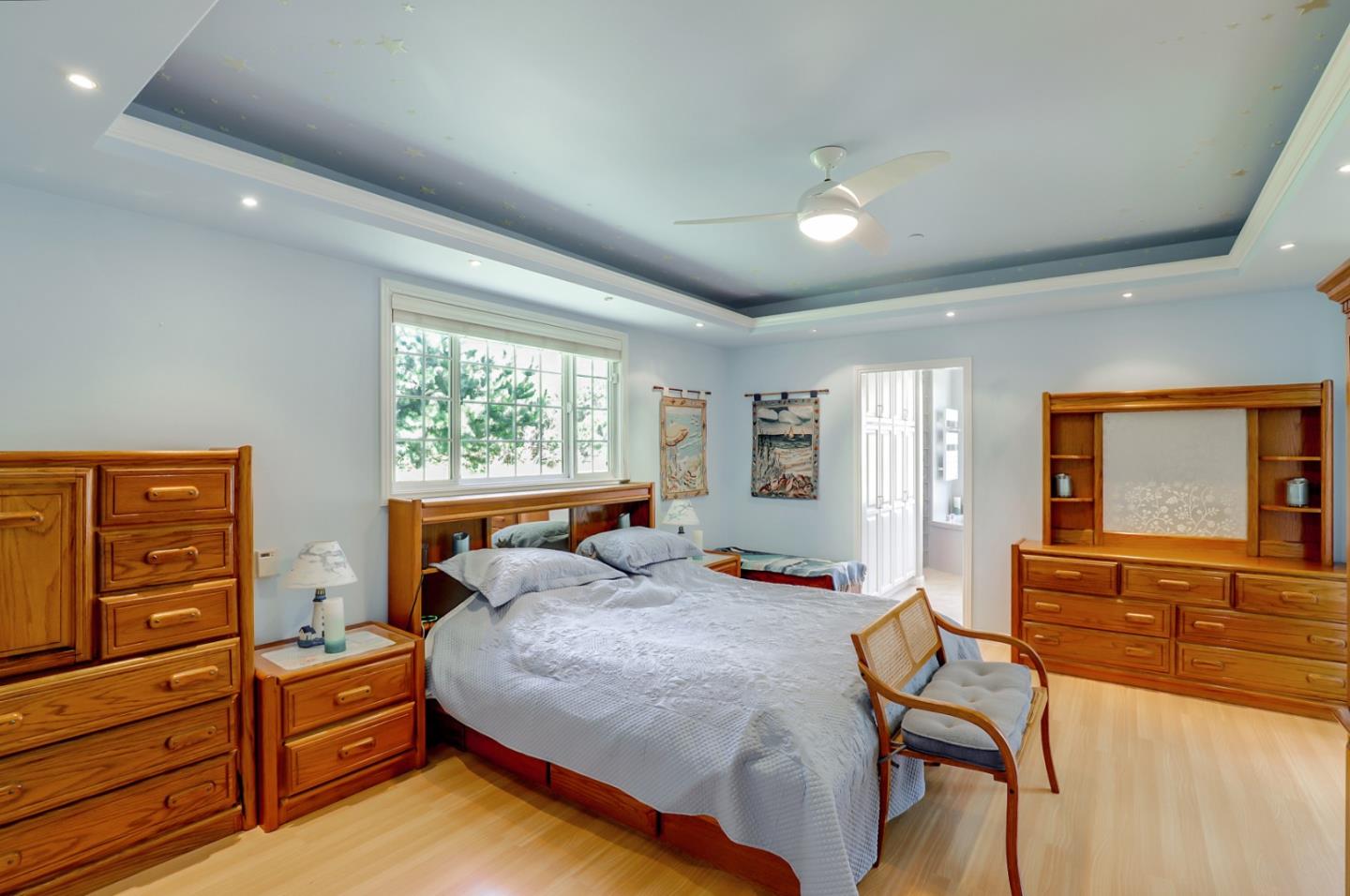 7840 Stage Road San Gregorio, CA 94074 - Photo 16 of 42 a bedroom with a bed and wooden floor